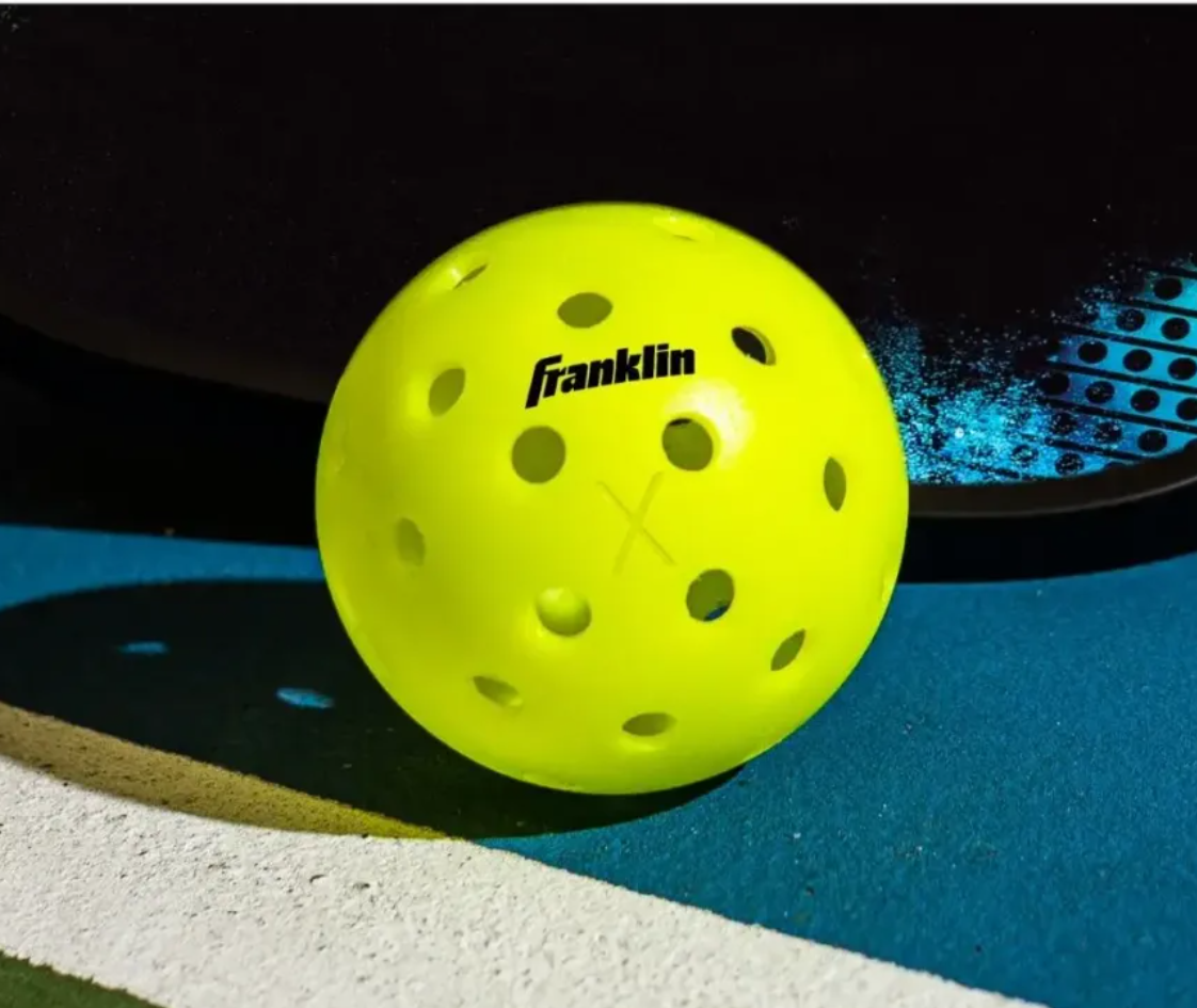 Pickleball ball and paddle